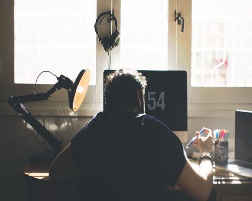 Man closing laptop to disconnect from work